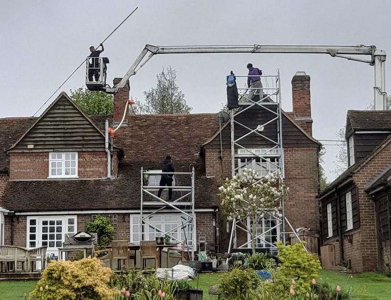 The Roof Moss Cleaners using cherry picker and scaffolding to clean roof safely and professionally in South Hayling, Hampshire
