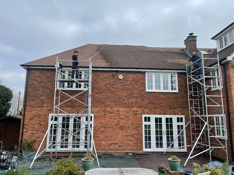Roof cleaning carried out safely from scaffold towers by The Roof Moss Cleaners in South Hayling